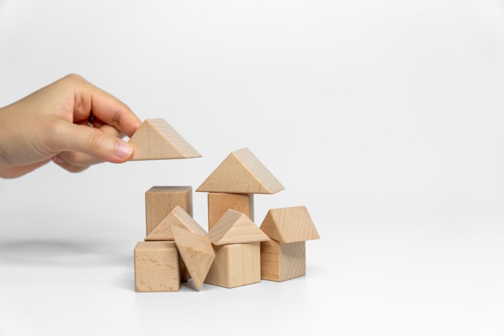 Sturdy foundation being built with blocks, representing the structure and stability of an internship in recovery